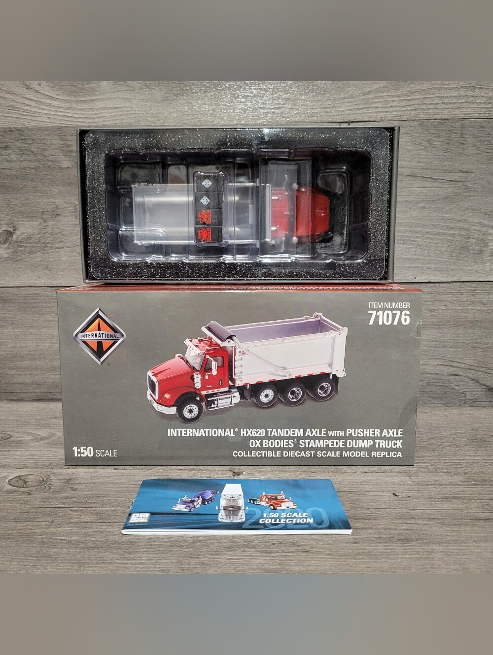 26 International Red and White HX620 Dump Truck Diecast Collectible